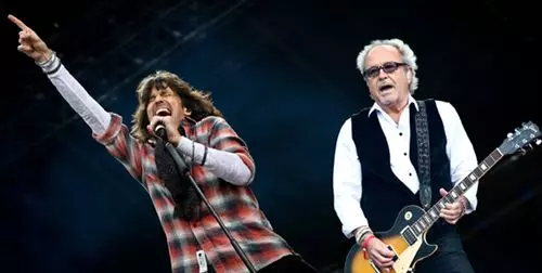 Foreigner performing live on stage